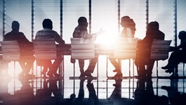 A row of people in conference room