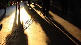 People walking in shadow