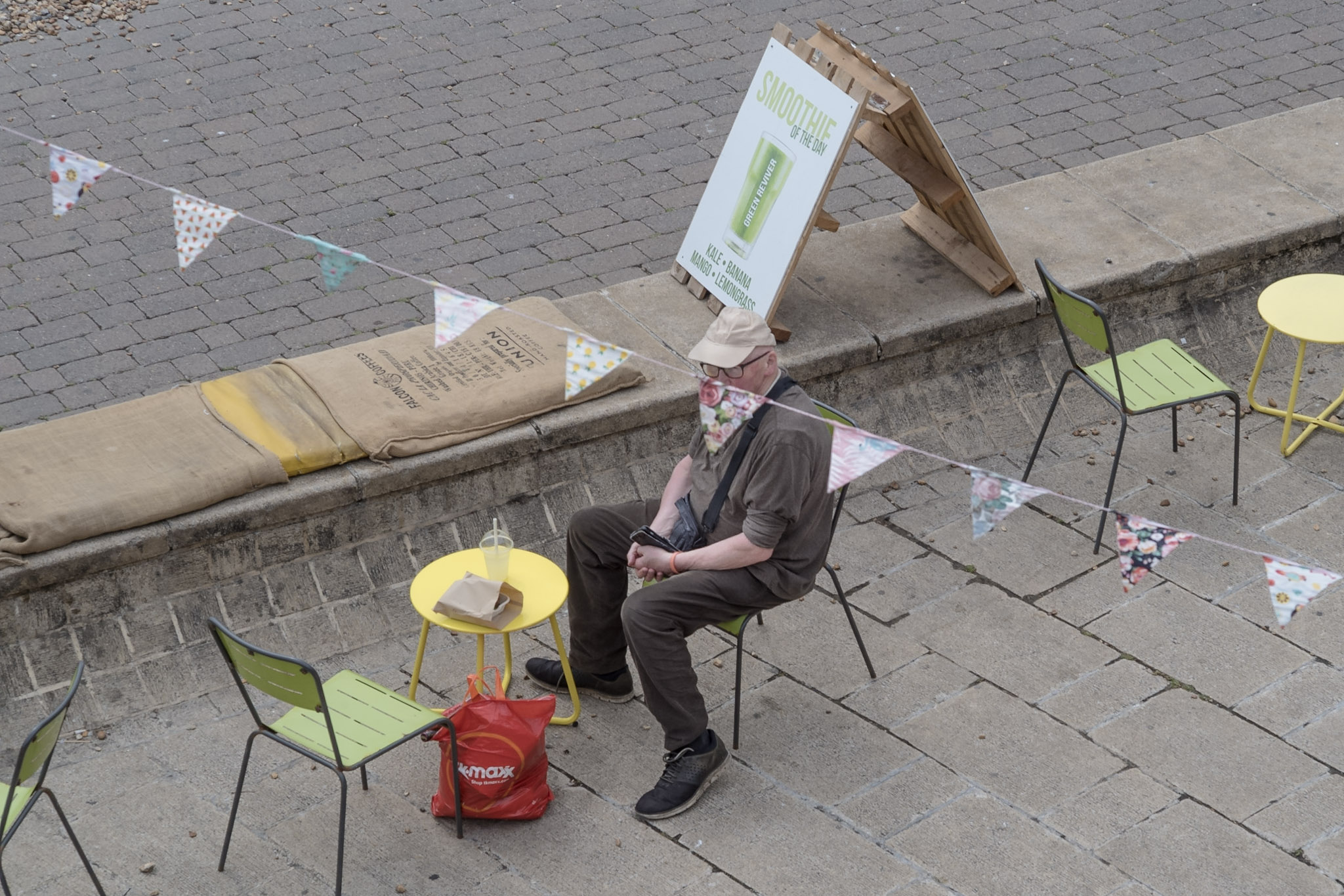 The man sitting alone by Mark Heathcote