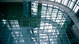 A view of a building interior with glass walls and ceilings