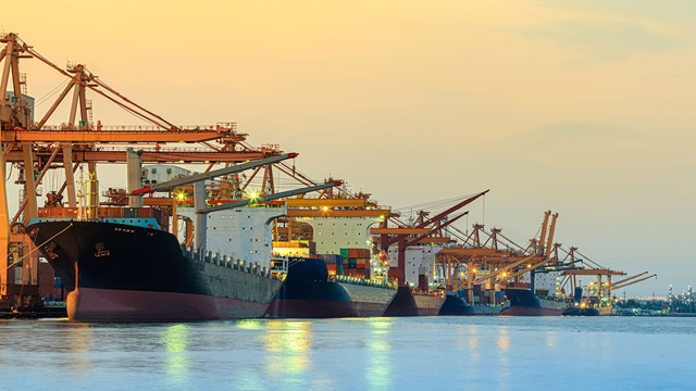 cargo ship with ports crane