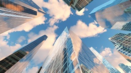 panorama of skyscrapers against sky with clouds