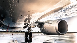 Bottom view of an airplane and its engine parked at the airport